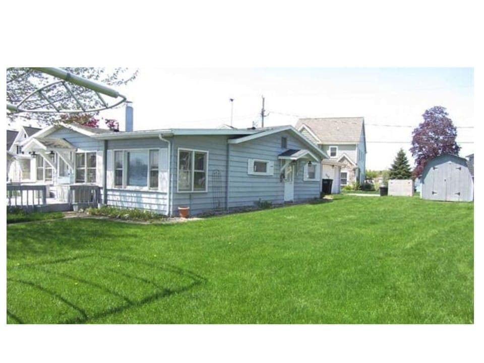 Nice size flat yard alongside cottage on the lakeside