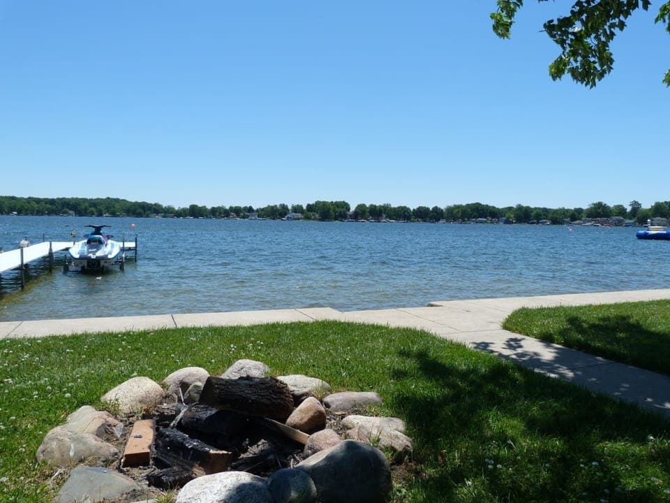 Large lake side fire pit with lake view