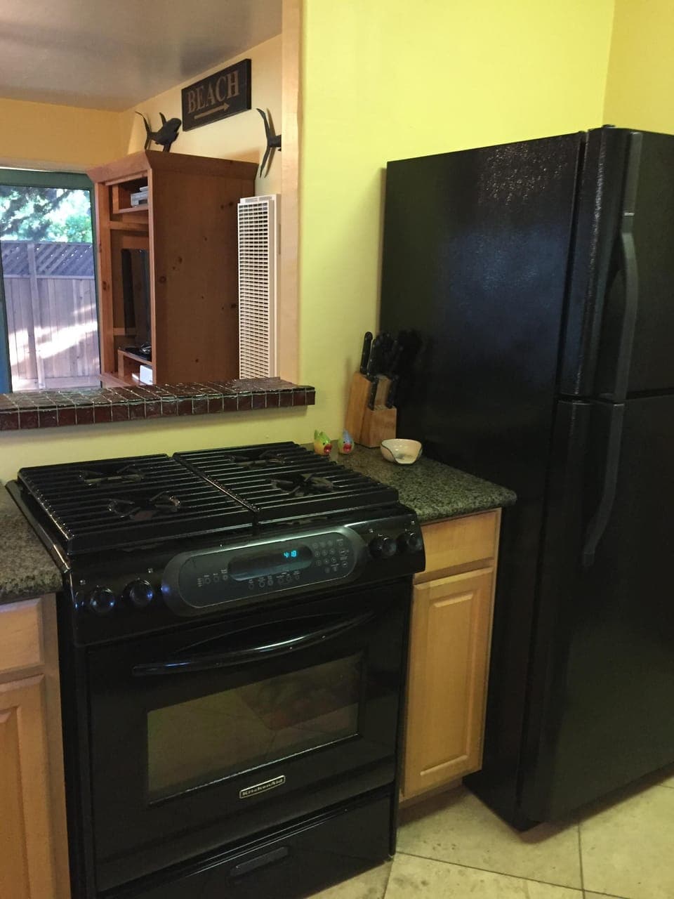 Kitchen comes equipped with Full sized Range, Refrigerator/ Dishwasher Microwave