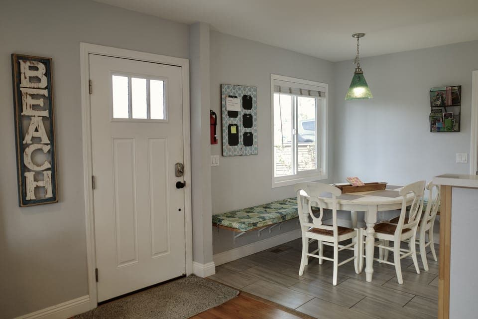 The front door opens to the fully fenced patio. 
