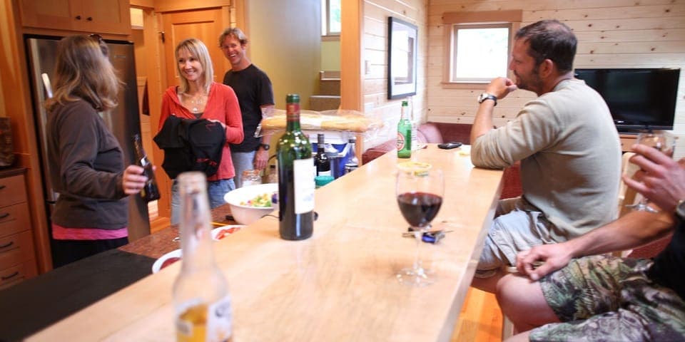 Friends arriving at Manzanita Summer Camp. Cocktails at the bar.