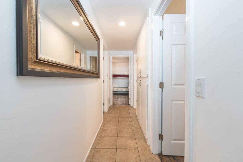 Central hallway leads from main living area to all 3 bedrooms and 2 baths.
                