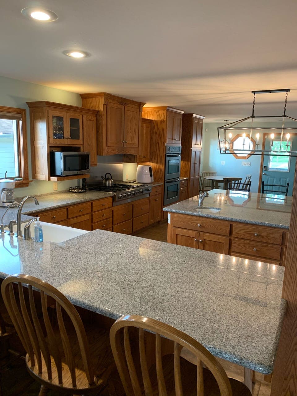 Granite Countertops,  Island is 7'x7' with 6 bar stools and counter also has 4 