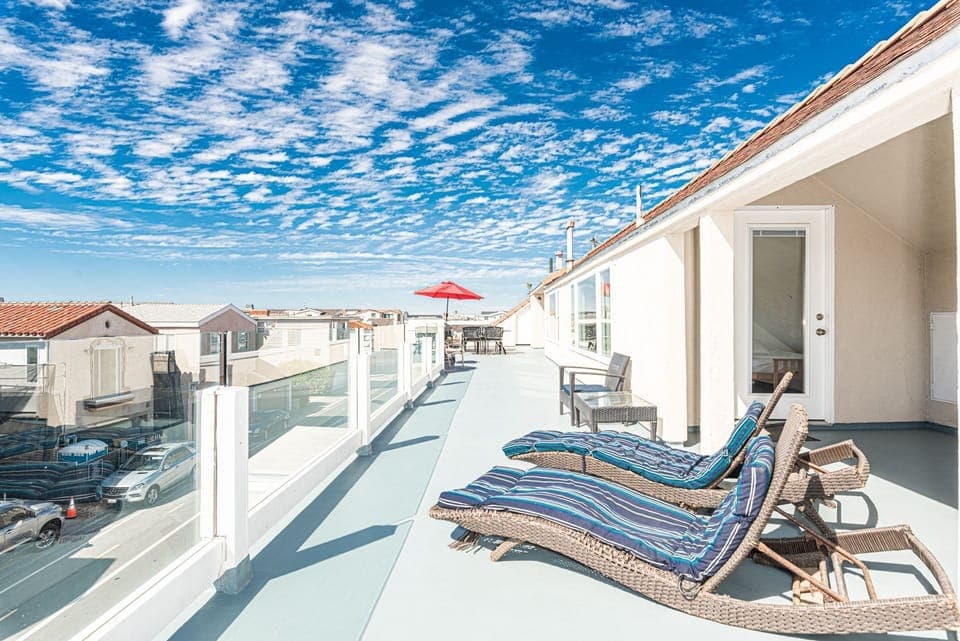 Panoramic views, including peek-a-boos of the ocean, are a guest favorite on the large, third level deck. Lots of sunny seating and an enclosed bonus room as well.
                