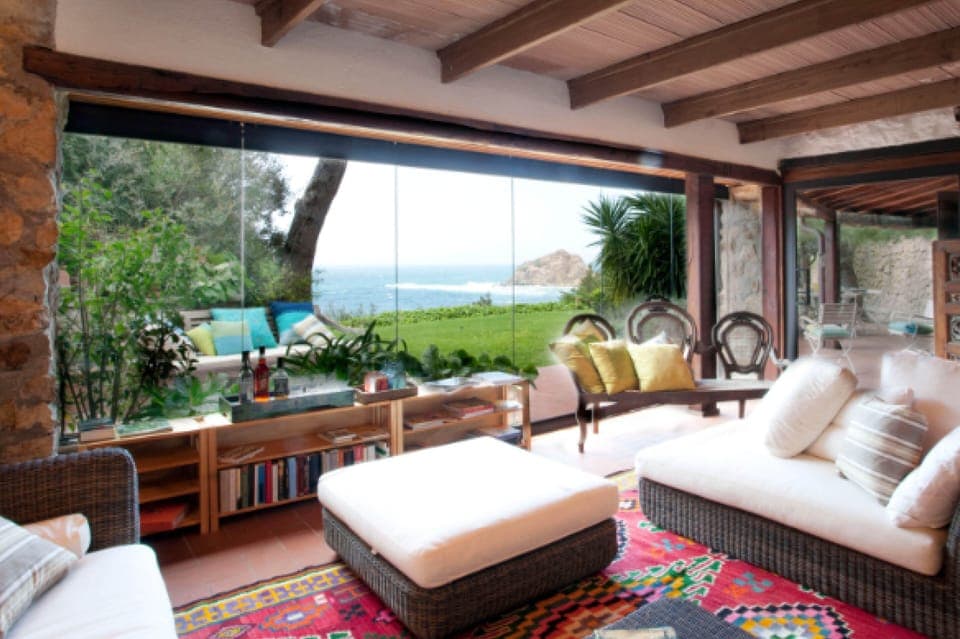 living room with retractable glass panels