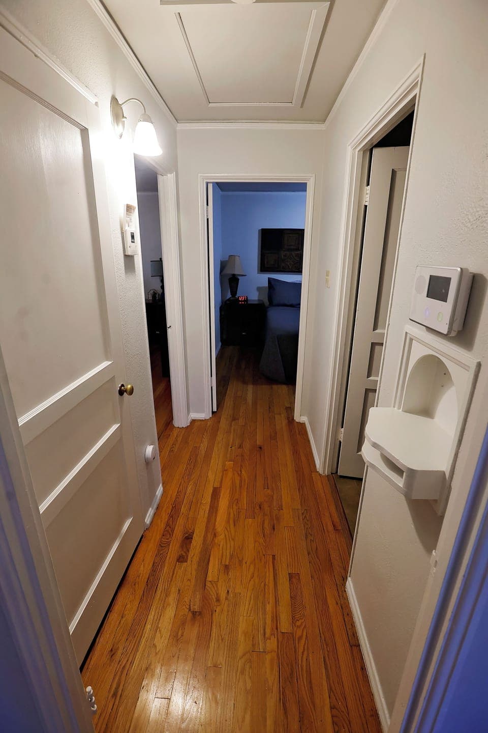 Bright, clean hallway connecting the living spaces with a welcoming feel.