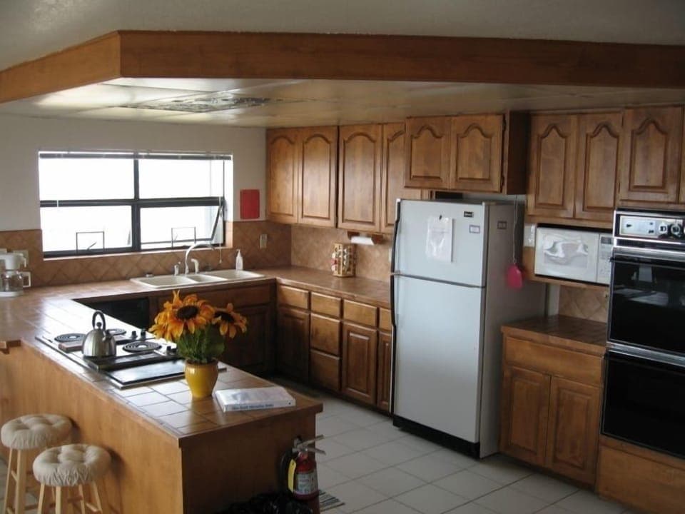 Large kitchen with double ovens,stove top,microwave,dishwasher, and lots of room