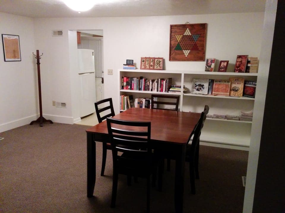Dining room with books, games and second table for eating (6 person in kitchen)
