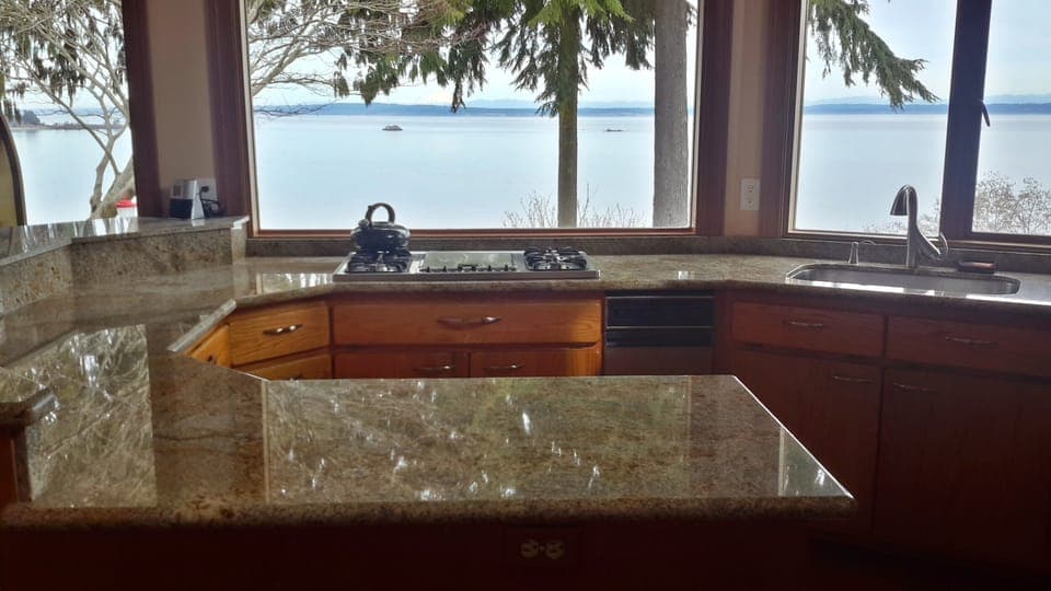 View of Mt. Baker and Sound from Kitchen over granite counter top