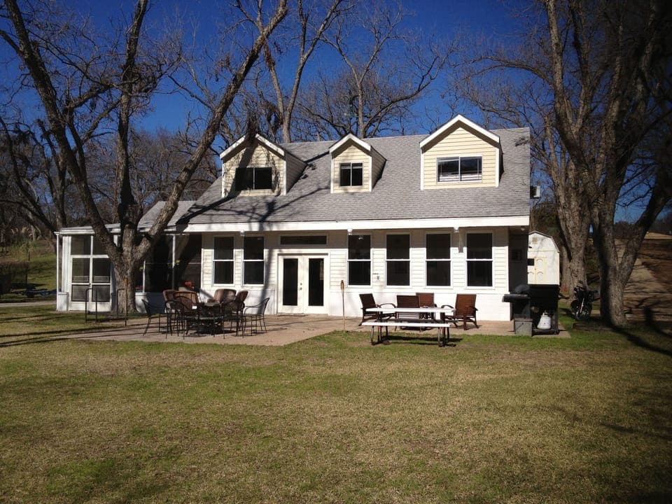 Our old pecan trees are full of leaves in summer for a shady place to relax!