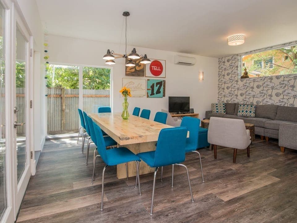 Large hand made dining table from salvaged wood makes for a wonderful dinner.