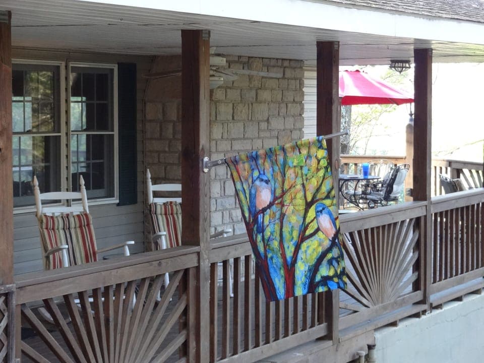 sit and rock on the covered deck or eat at 1 of 2 tables on the open deck