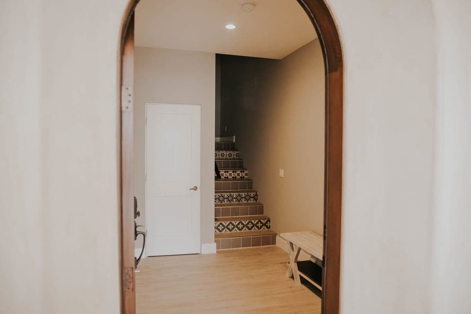Entrance, showing hand-painted Spanish tiles on stairs.