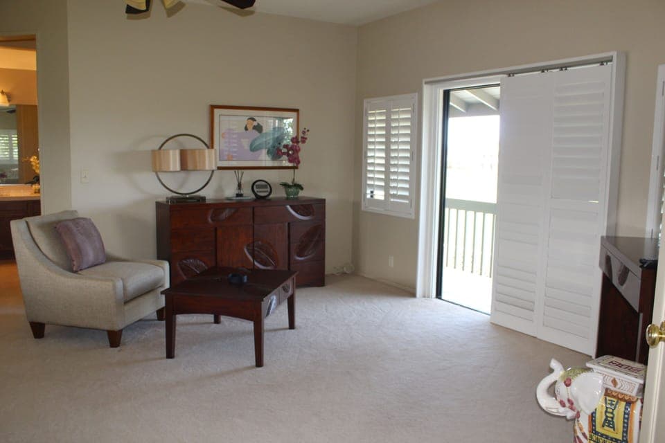 Sitting area in master suite with a view of the golf course.