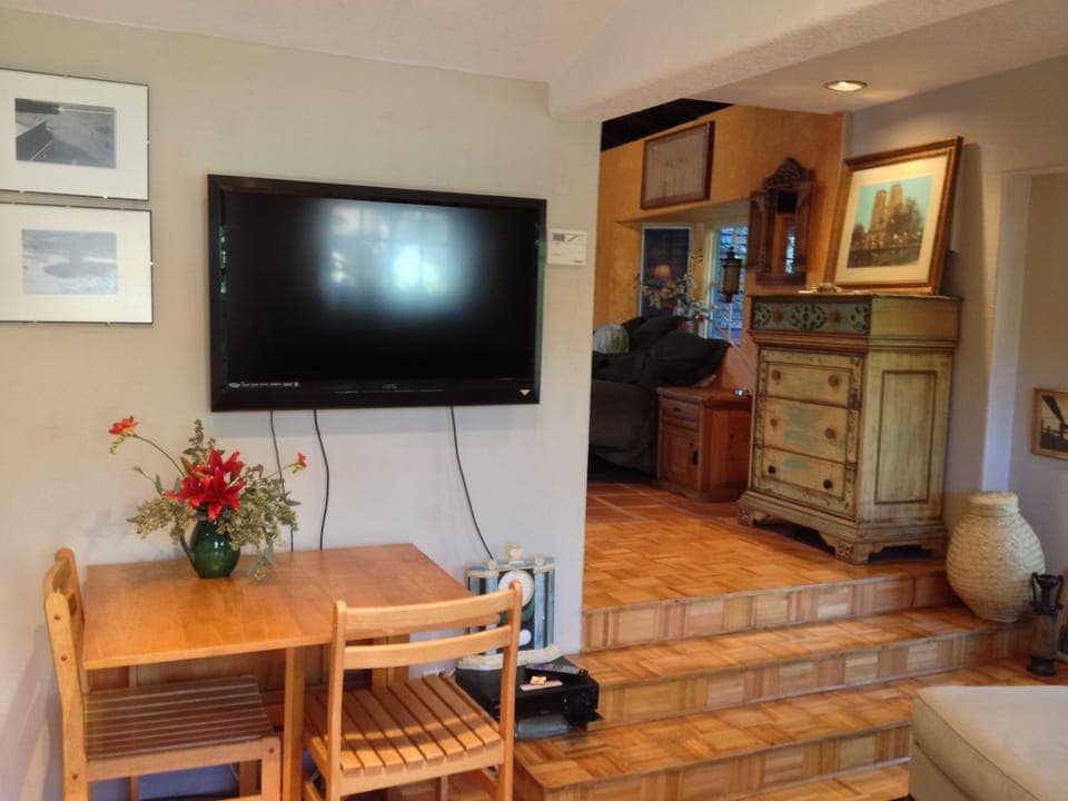 dining within living area and entrance to bedroom