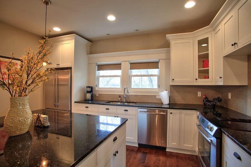 Gourmet Cooks Kitchen with slab granite counters & top end appliances
