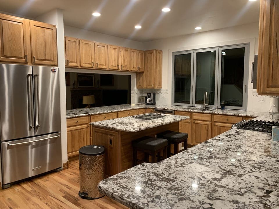 Granite countertops and KitchenAid Stainless appliances.
