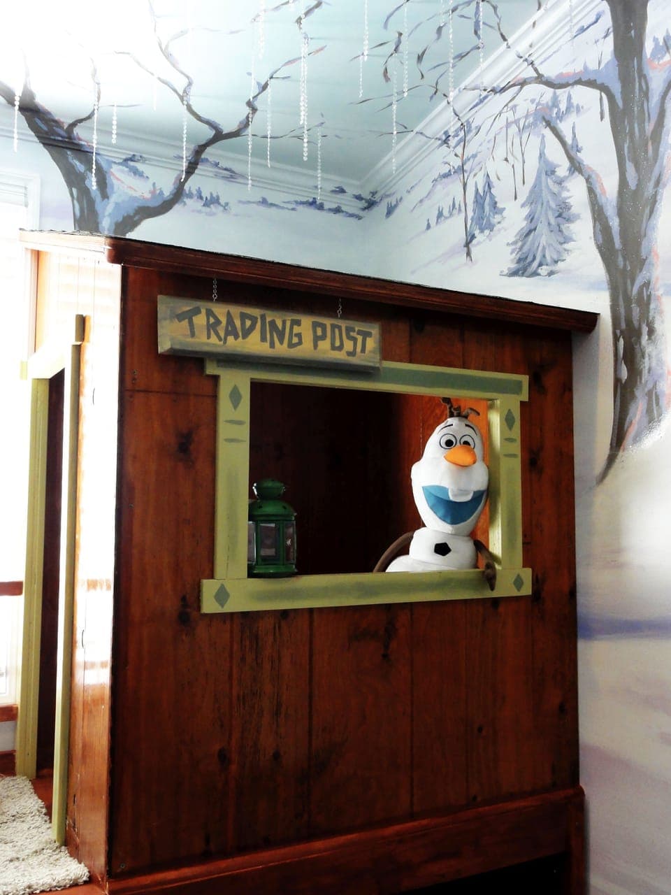 The Trading Post playhouse is always open for fun!  Twin trundle bed below.