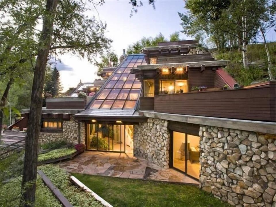 View of house showing sloping glass roof that creates views from all 4 levels