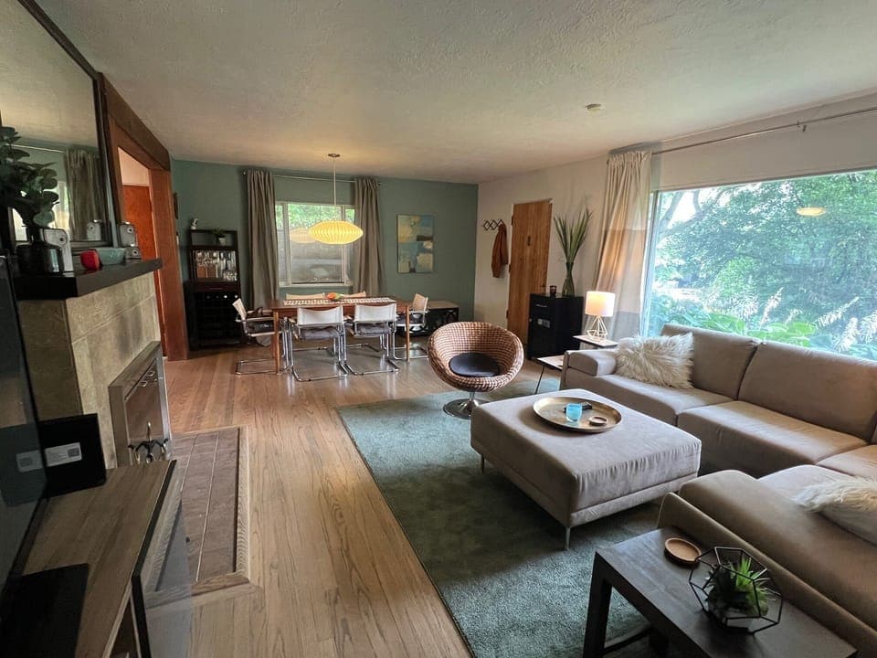 View of Living room, entrance, and dining from hallway. 