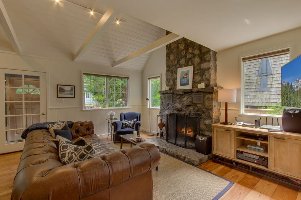Classic rock fireplace, plenty of windows and high ceiling in the great room.