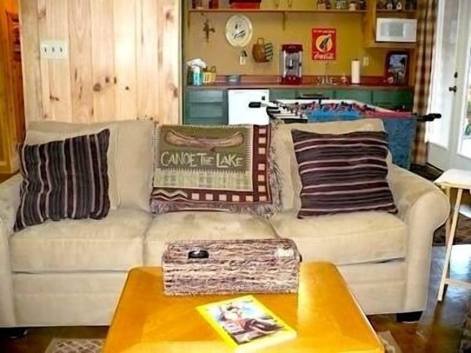 Sofa in game room - large screen TV to watch the game! Wet bar with mini refrig.