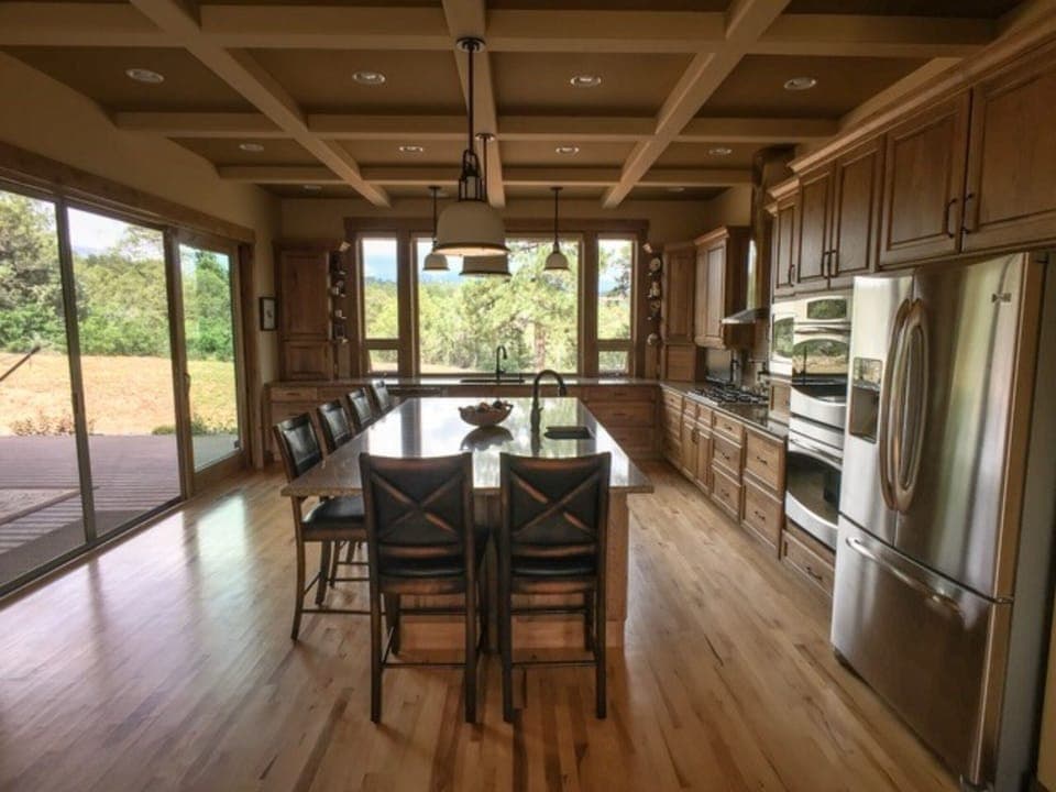 The sliding glass doors on the left bring in  the feeling of the outdoors.
