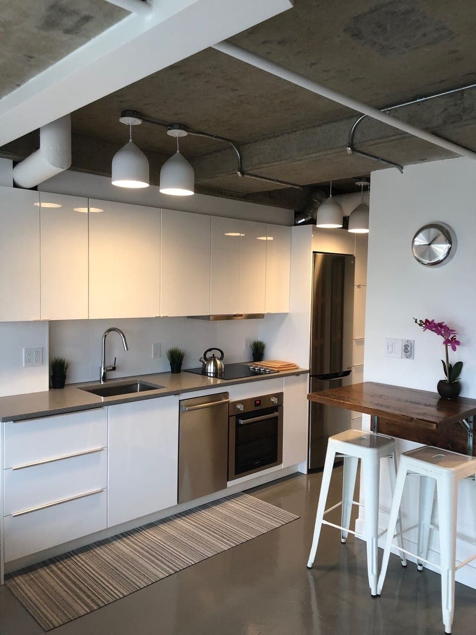 Newly renovated modern kitchen with Bosch stainless steel appliances throughout.