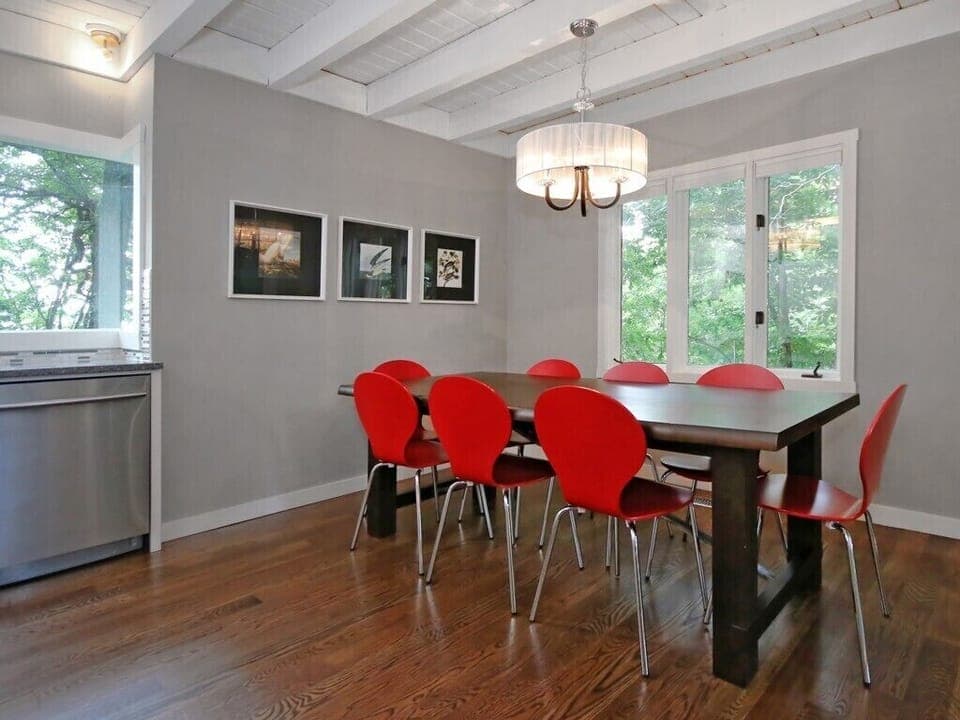 Dining area - seats 6-8 at table, two at bar, and 4 more in adjacent living room