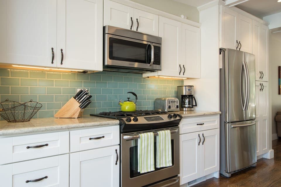 Gourmet kitchen has a gas range,  granite counter tops and all meal amenities 