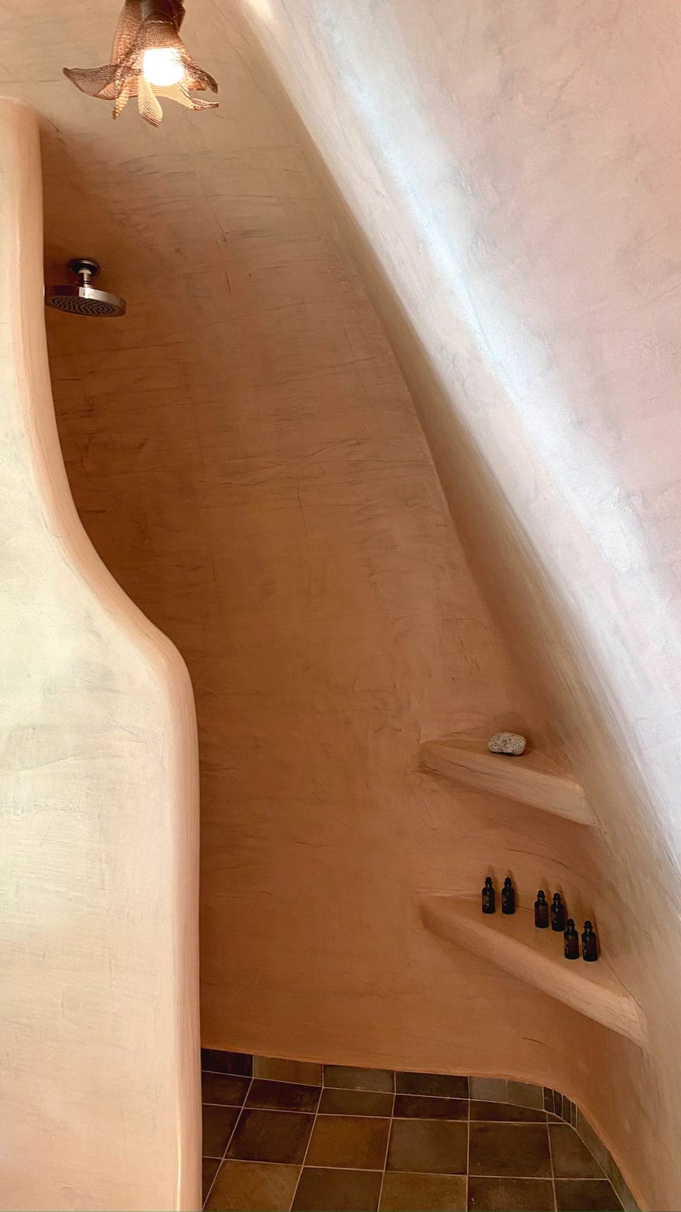 Cave style shower experience at upper level suite bathroom.