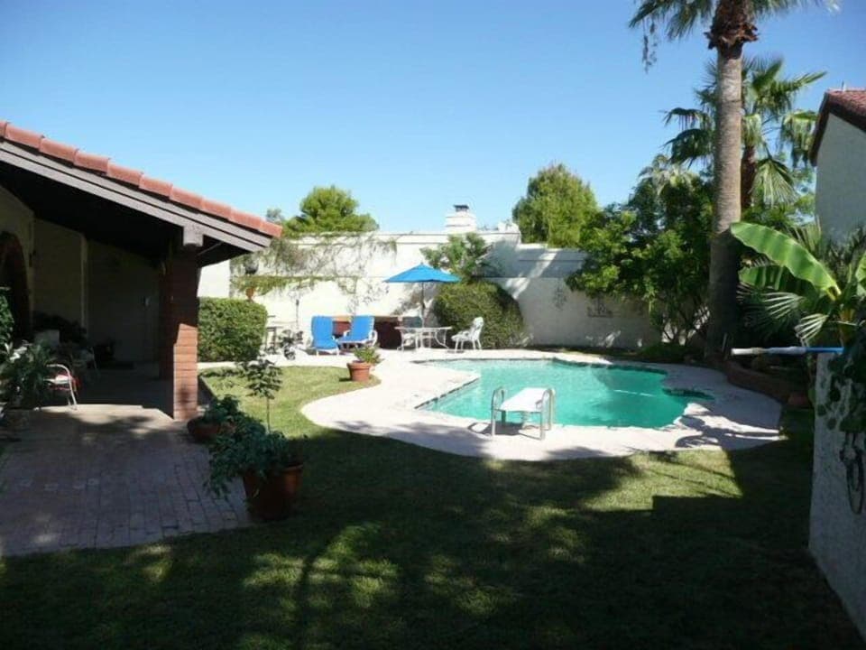 OVERVIEW OF PRIVATE FRONT YARD WITH POOL