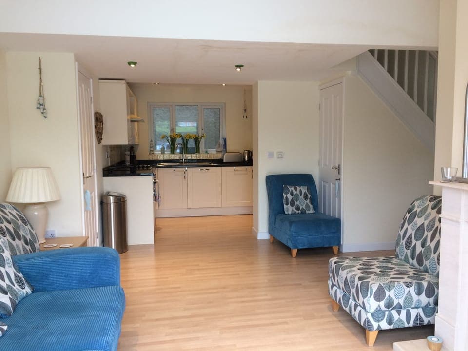 Open plan living room looking towards the kitchen. 