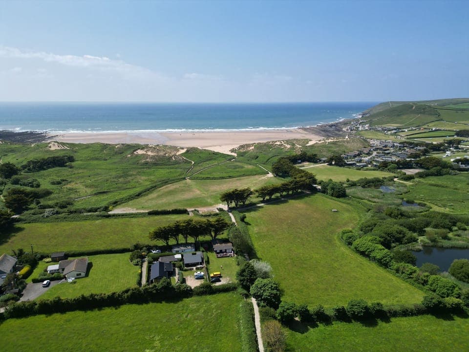 Drone shot showing the short walk to beach. NB Not a view from the house itself.