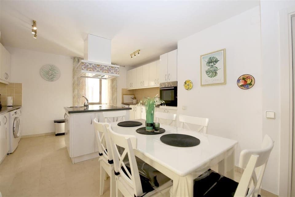 Kitchen in this apartment is fully fitted with all the appliances