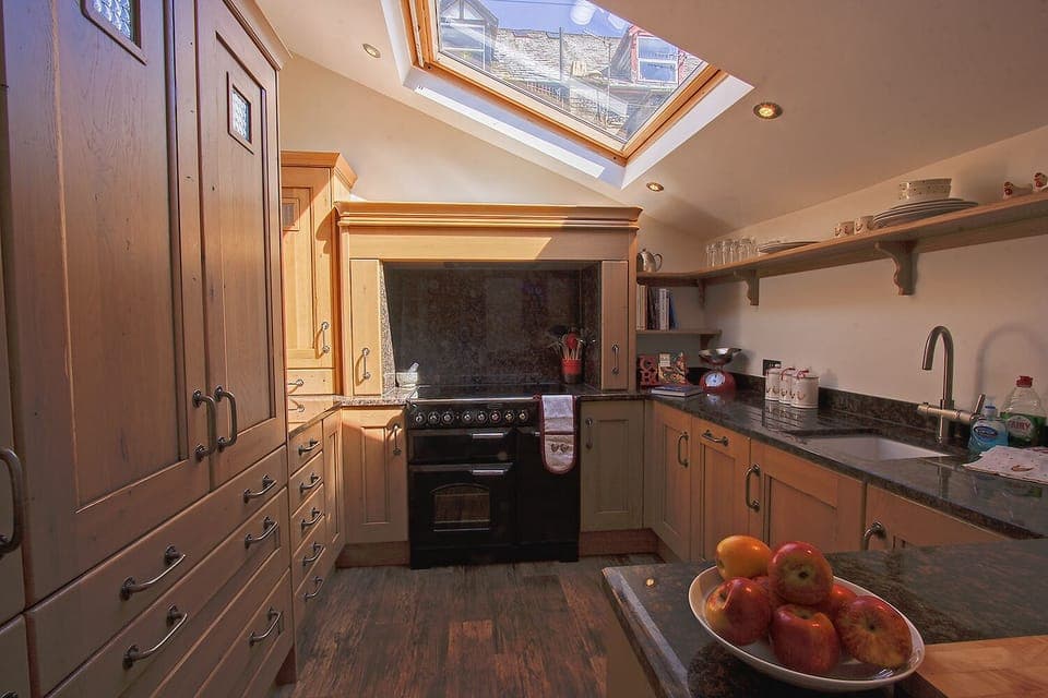 Spacious and bright kitchen with all modern appliances and ample storage.