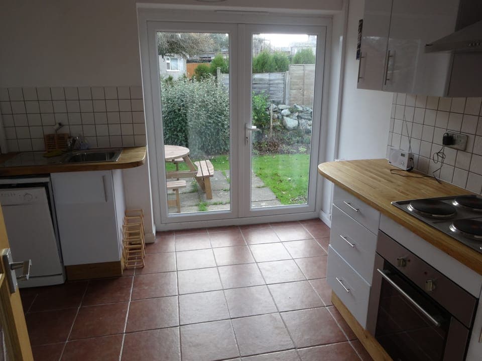 Kitchen with big doors to garden. Easy to keep clean. Tesco deliever close by