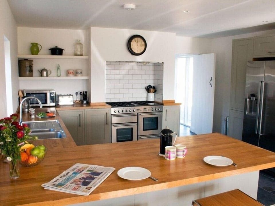 Fully Stocked Kitchen with breakfast bar