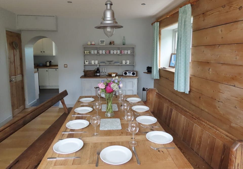 Dining room with a view into the kitchen