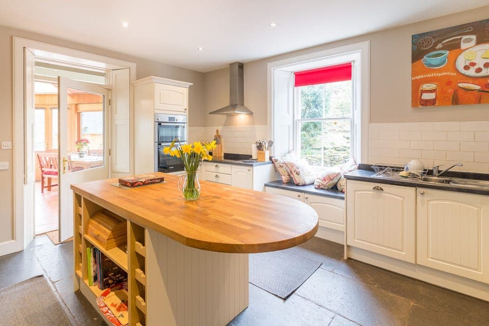 Kitchen with door into garden room
