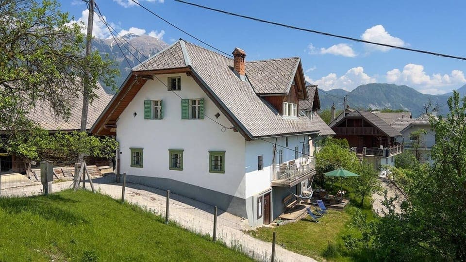 The traditional alpine farm house is cool in summer even as the  south facing balcony and lawn are perfect spots for sun worshipers. 