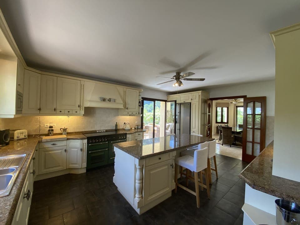 Large luxury kitchen leading to lounge or outside terrace dinning areas