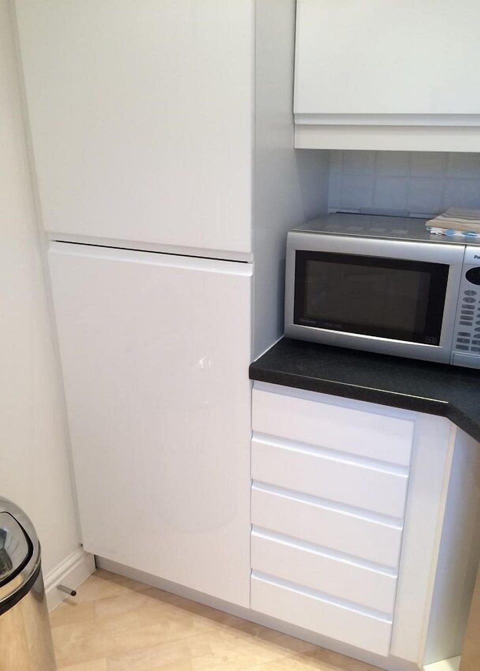 The kitchen with integrated fridge freezer and microwave.