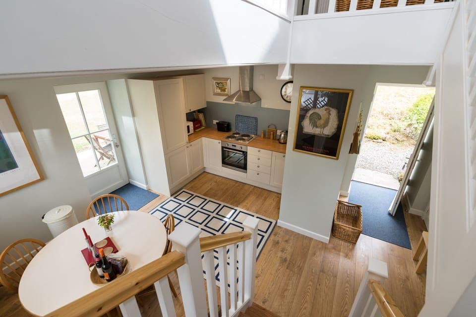 Open front door, hall, kitchen/dining of Vorlich Cottage