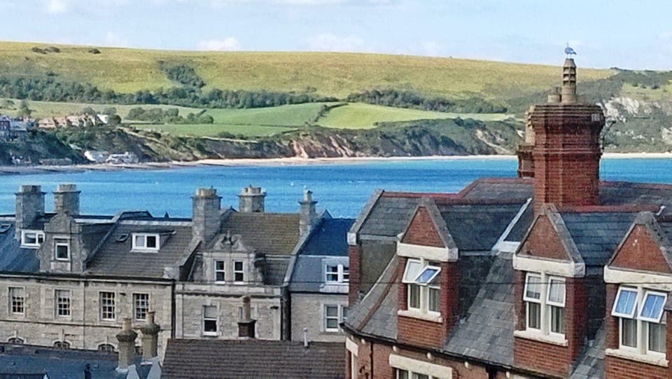 View from balcony across Swanage bay on a clear day