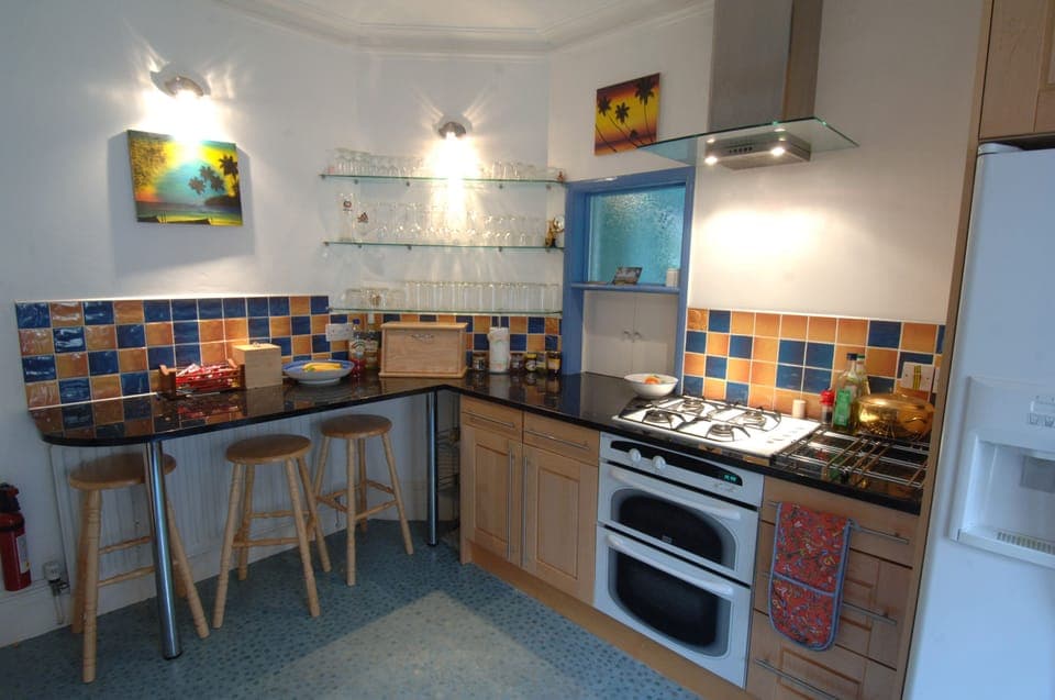 Kitchen with Breakfast bar and hatch thru to Dining room