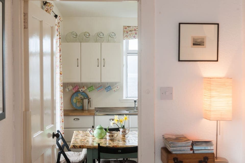 View to kitchen. Cath Kidston crockery.