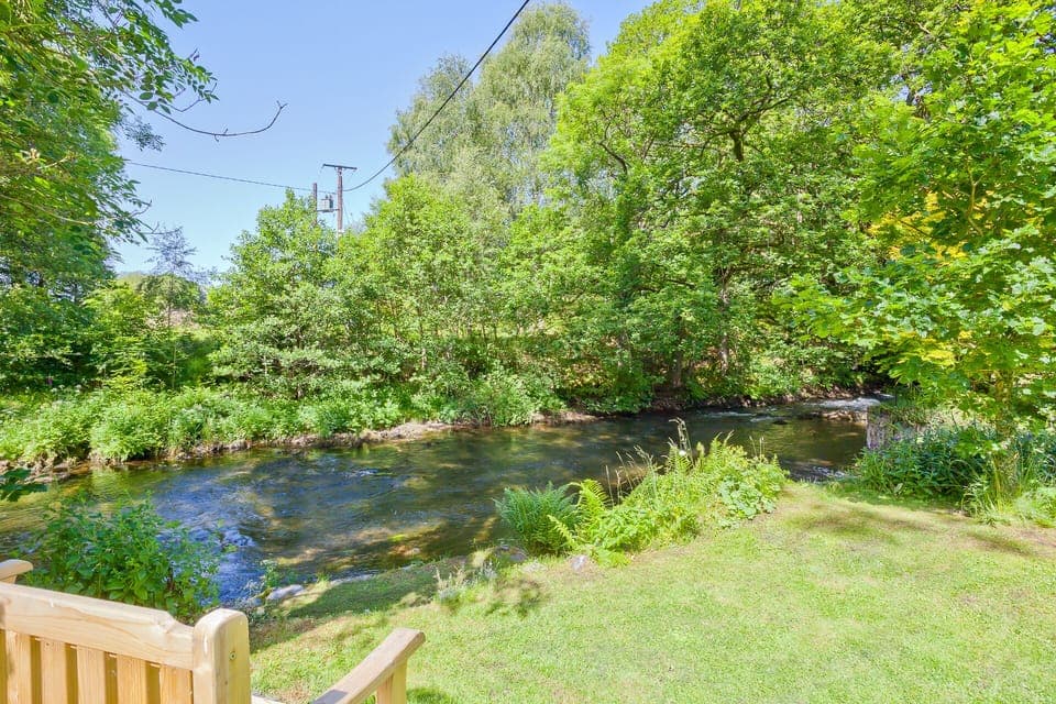 Our garden bench by the River Crake