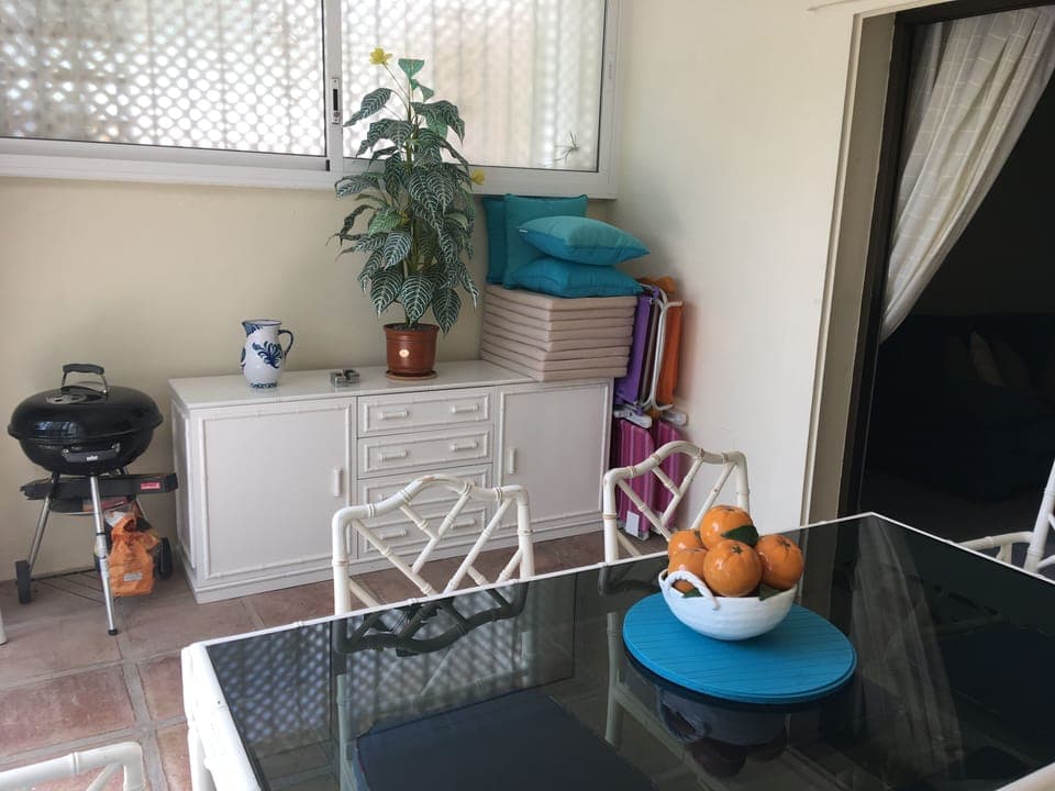 Sun room with dining table & storage for beach chairs, cushions, parasol & BBQ