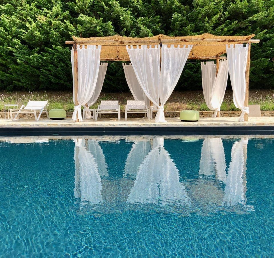 the heated pool and gazebo in summer